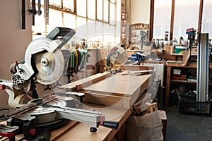 Mitre saws on workbenches in a carpentry workshop