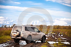 Mitsubishi Pajero/Montero at dirt road after rain