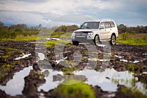 Mitsubishi Pajero/Montero at dirt road after rain