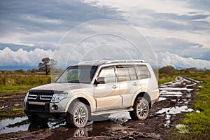 Mitsubishi Pajero/Montero at dirt road after rain