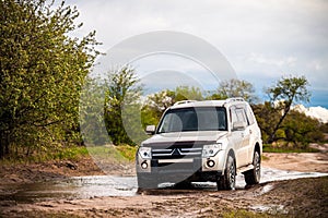 Mitsubishi Pajero/Montero at dirt road in summer