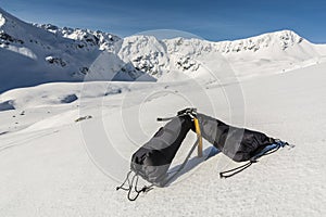 Mittens clipped carabiner for ice axe.