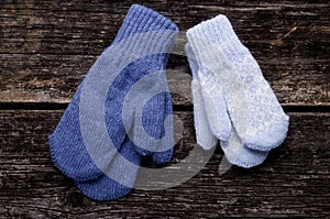 Mittens on wood background