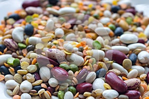 Mix of beans, peas, mung, lentil and kidney beans closeup. Organic healthy food. Mixed beans in perspective.