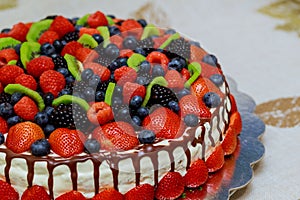 mix berries cake with beautiful berries strawberries, raspberries, blueberries