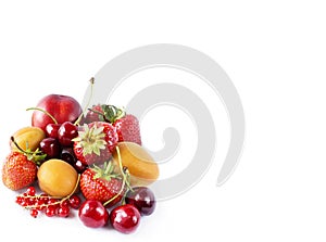 Mix berries and fruits isolated on white. Berries and fruits with copy space for text. Ripe strawberries, cherries, apricots red c