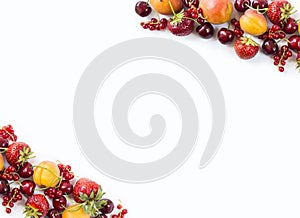 Mix berries isolated on a white. Ripe apricots, red currants, cherries and strawberries. Berries and fruits with copy space for te