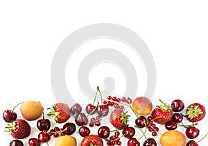 Mix berries isolated on a white. Ripe apricots, red currants, cherries and strawberries. Berries and fruits with copy space for te