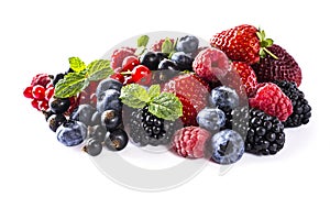 Mix berries isolated on a white. Ripe blueberries, blackberries, raspberries, currants and strawberries with mint. Berries and fru