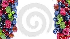 Mix berries on a white background. Berries and fruits with copy space for text. Black-blue and red food. Ripe blueberries, raspber