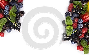 Mix berries on a white background. Ripe currants, strawberries, blackberries, blueberries, blackcurrants, raspberries with mint le