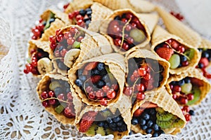 Mix of berry fruits in the ice cream cone