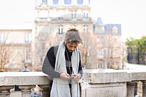 Mix blood music lover enjoying new earphones and smartphone nea