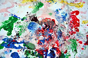 Mix blue green pink yellow red white gray abstract wet paint background. Painting spots.