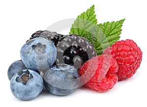 mix of blueberries, blackberries, raspberries isolated on white background photo