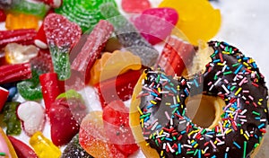 Mix of candies sweets donuts and sugar