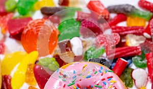 Mix of candies sweets donuts and sugar