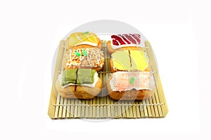 Mix color Sushi Donuts in bamboo dish.