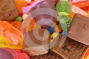 Mix Colorful Candies With Biscuits Closeup