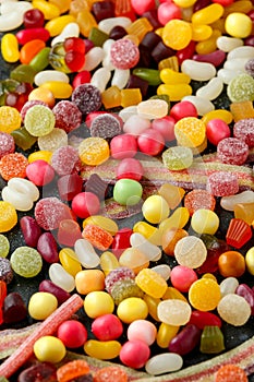A mix of colorful candy on background, texture