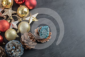 Mix of colorful oak tree ornaments on a dark background