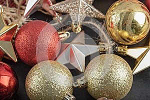 Mix of colorful oak tree ornaments on a dark background