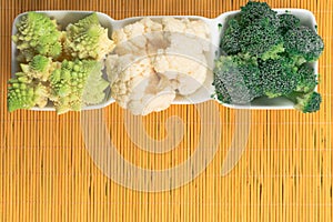 mix of diffenent cabbage on straw mat