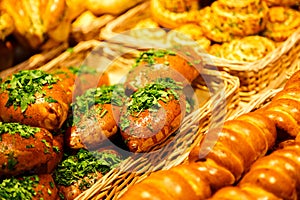 Mix of different fresh baking, pastry, small pie at the shelfs of bakery