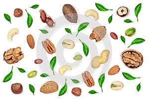 Mix of different nuts decorated with green leaves isolated on white background, Flat lay pattern, Top view