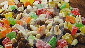 Mix of dried fruits, candied fruits and nuts rotate in a circle
