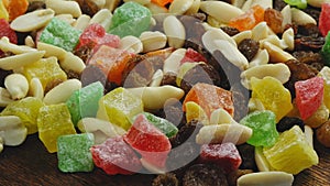 Mix of dried fruits, candied fruits and nuts rotate in a circle