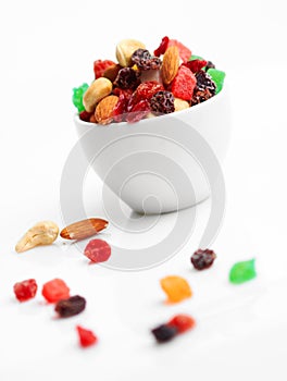 Mix dried fruits and nuts in cup