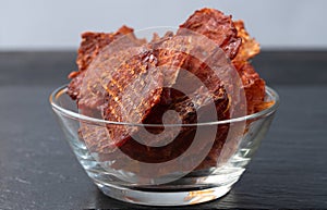 Mix of dried meat Jerky . From chicken , beef and pork