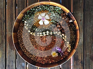 Mix dry herb for herbal ball on wooden table