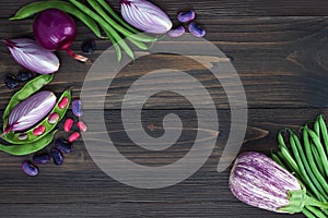 Mix of fresh farmers market vegetable from above on the old wooden board with copy space. Healthy eating background. Top view