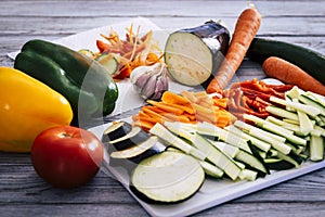 A mix of fresh filleted vegetables, courgettes, carrots, peppers and aubergines ready to be cooked and used for rolls