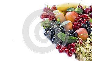 Mix fruits berries on white background. Ripe black, red, white currants, strawberries and apricots. Sweet and juicy fruits with co