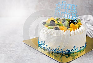 Mix fruits: Kiwi orange and grape on cream cake,