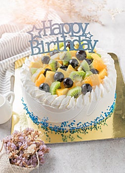 Mix fruits: Kiwi orange and grape on cream cake