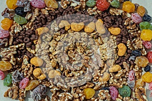 Mix of Healthy Snack of nuts and Other Dried fruits mix on gray background
