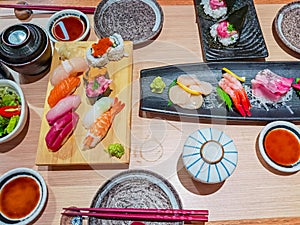 Mix of Japanese food sushi and rolls on restaurant table in restaurant in Central, Hong Kong