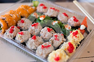 Mix japanese sushi rolls in take away package