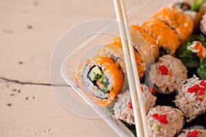 Mix japanese sushi rolls in take away package