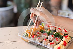 Mix japanese sushi rolls in take away package