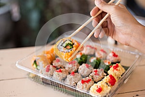 Mix japanese sushi rolls in take away package