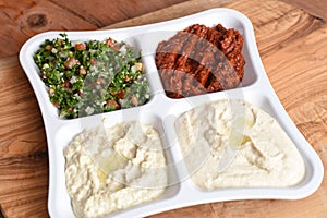 Mix of Middle-Eastern dishes on a wooden background