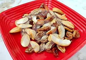 Mix of nuts and dried fruits. Gold pistachios, cashews, Raisin, almonds