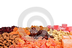 Mix of nuts and dried fruits and sweet turkish delights background