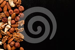 Mix of nuts frame on a black table