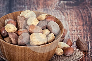 Mix nuts in a wooden bowl